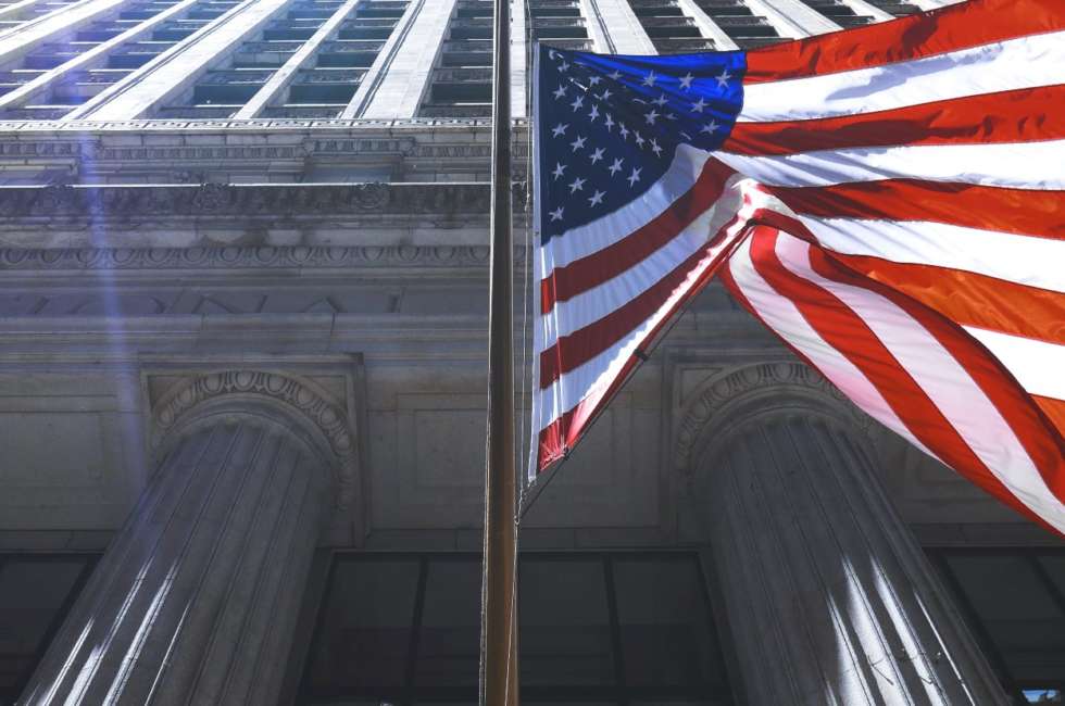 American flag in front of old commerce building